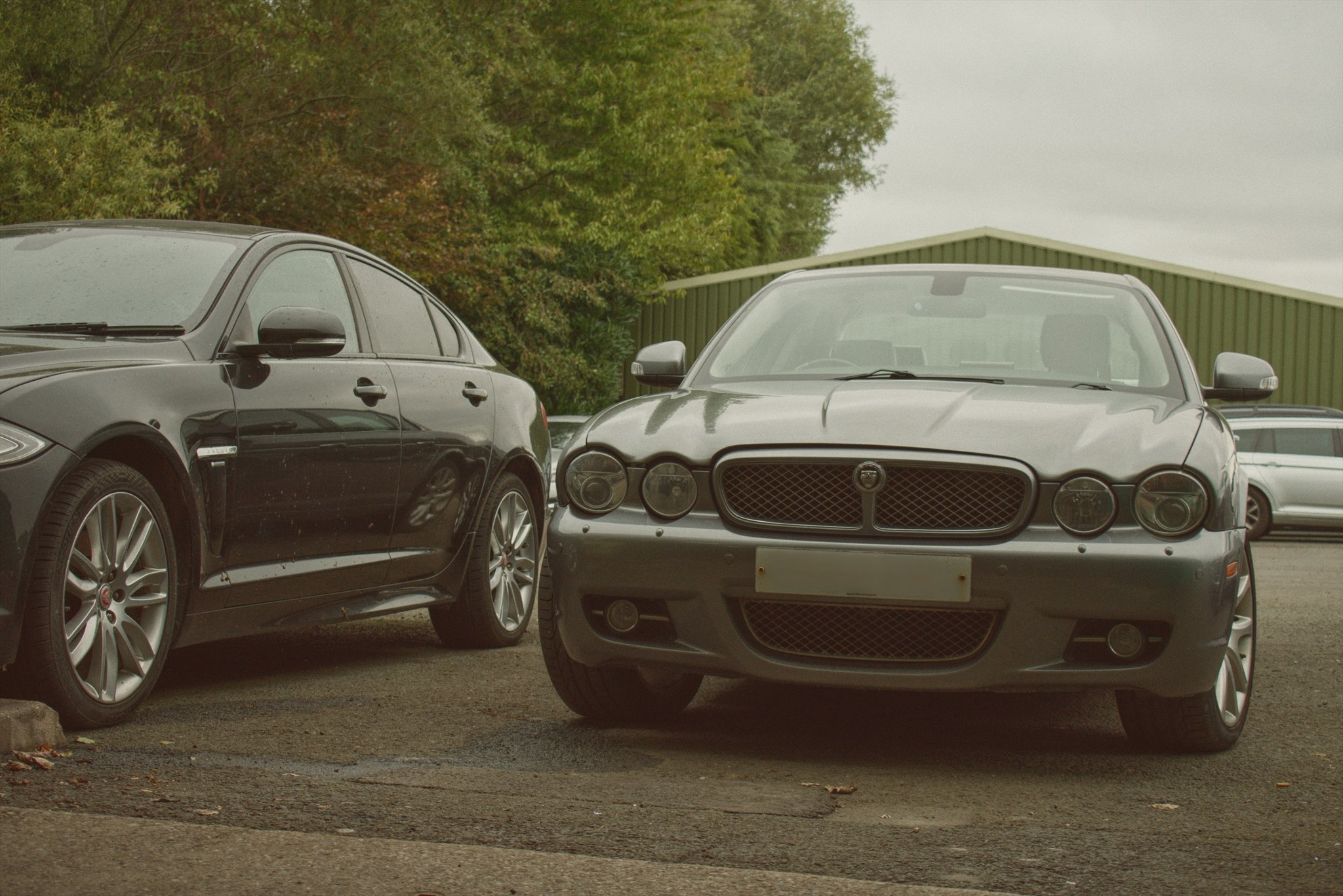 Silver Jaguar XJ and black Jaguar XF outside Harrogate Jagwar Specialists